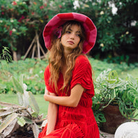 BrunnaCo Shilo checkered crochet hat in red and pink with a stylish knit pattern and snug fit, perfect for casual wear.