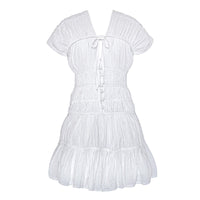 White The Srikandi Mini Ruffle Dress by BrunnaCo, featuring ruffled details and a stylish mini length, displayed on a hanger.