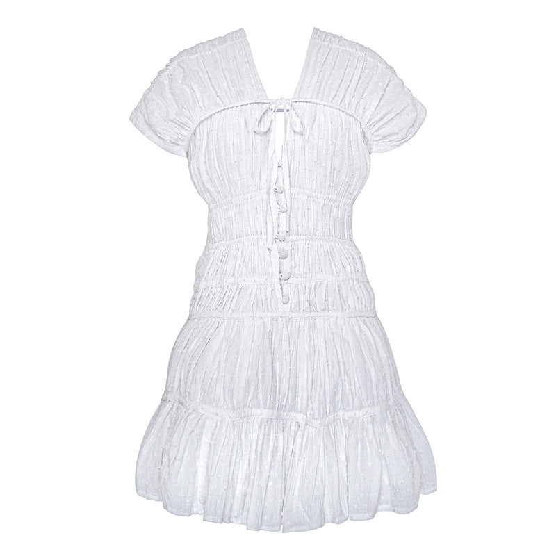 White The Srikandi Mini Ruffle Dress by BrunnaCo, featuring ruffled details and a stylish mini length, displayed on a hanger.