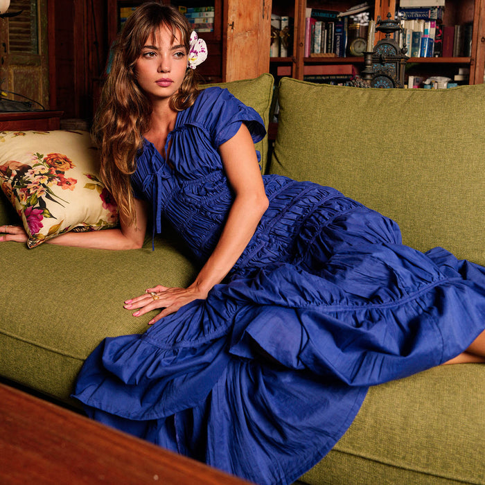 Royal blue Srikandi Ruffle Maxi Dress by BrunnaCo, featuring flowing fabric and elegant ruffle details.