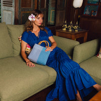 Royal blue Srikandi Ruffle Maxi Dress by BrunnaCo, flowing fabric with ruffle details, styled for elegant summer occasions.