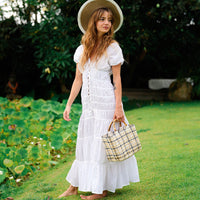 White BrunnaCo Srikandi Ruffle Maxi Dress with flowing fabric and ruffled details, perfect for elegant summer occasions.