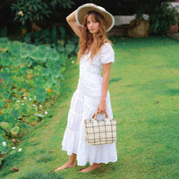 White Srikandi Ruffle Maxi Dress by BrunnaCo, featuring flowing fabric and ruffled details, perfect for elegant summer occasions.