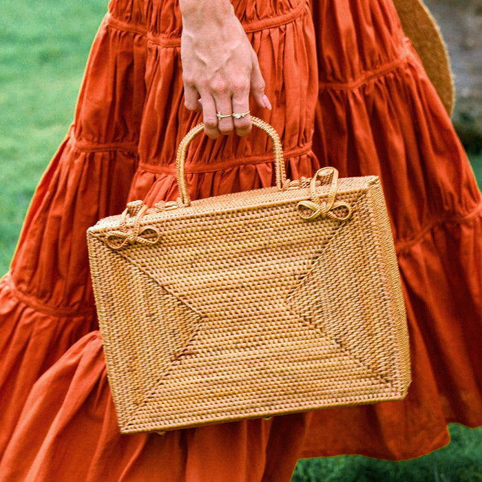BrunnaCo RAHAYU Atta rattan handbag in mocca brown with woven design and rounded shape.