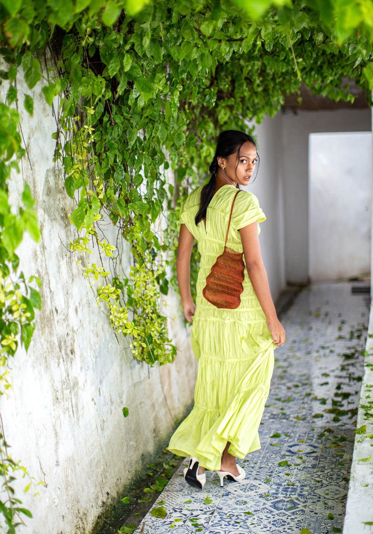 BrunnaCo Shell handwoven wire handbag in copper with intricate woven design and sturdy handle.
