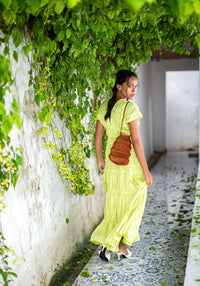 BrunnaCo Shell handwoven wire handbag in copper with intricate woven design and sturdy handle.