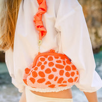 BrunnaCo Arnoldi Peachpuff clutch bag in orange and peach with glass bead details, stylish handbag for elegant occasions.