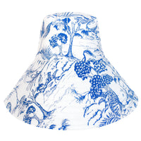 BrunnaCo NAU Botanica hat in indigo blue, stylish wide-brim hat with natural straw accents and floral design.