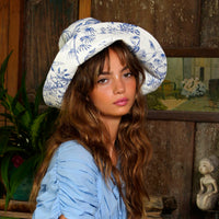 BrunnaCo NAU Botanica hat in indigo blue, stylish wide-brim hat with natural fiber texture suitable for sun protection.