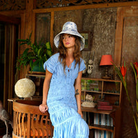 BrunnaCo NAU Botanica hat in indigo blue, stylish wide-brim hat made of woven material, perfect for sun protection and fashion.