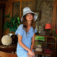 BrunnaCo NAU Botanica hat in indigo blue, stylish wide-brim hat with woven texture for sun protection and fashion.