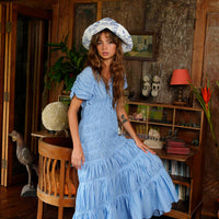 BrunnaCo NAU Botanica hat in indigo blue, stylish wide-brim fashion hat with natural woven texture and adjustable band.