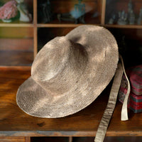 BrunnaCo The Loli Jute Straw Sun Hat in neutral beige with wide brim and woven texture, perfect for sunny days.
