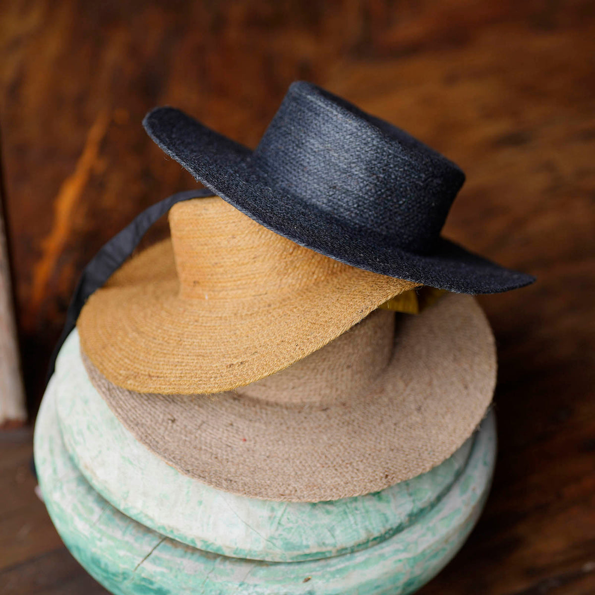 BrunnaCo The Loli Jute Straw Sun Hat in neutral beige with wide brim, perfect for sunny outdoor wear.