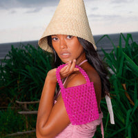 BrunnaCo Antonia tote bag with crystal bead embellishments in vibrant hot pink, featuring a spacious bucket design.