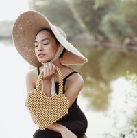 BrunnaCo Hati Heart wood-beaded tote bag with natural wood beads and spacious design for casual carrying.