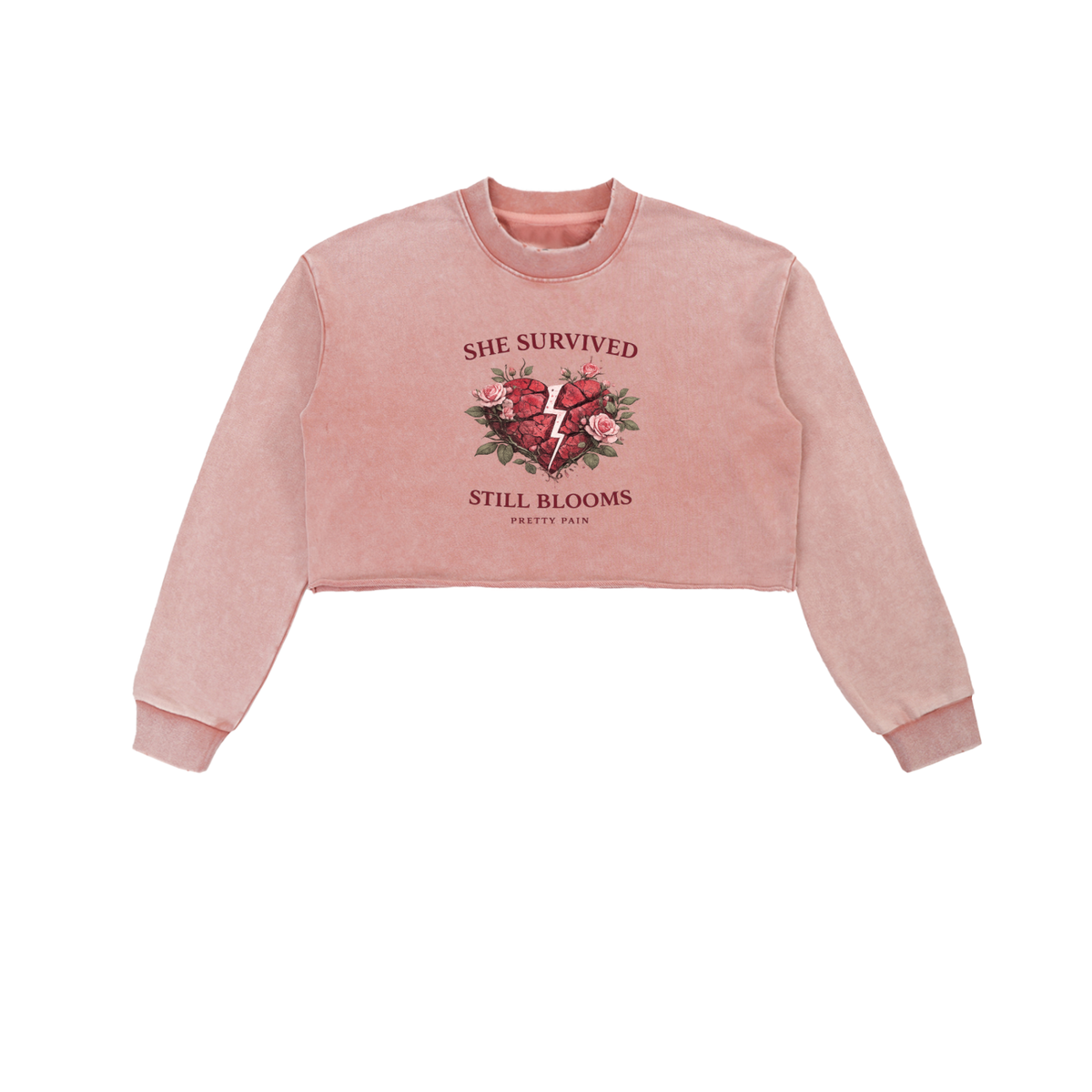 Built From Pain "She Survived Still Blooms" cropped sweatshirt featuring floral design and bold text on soft fabric.