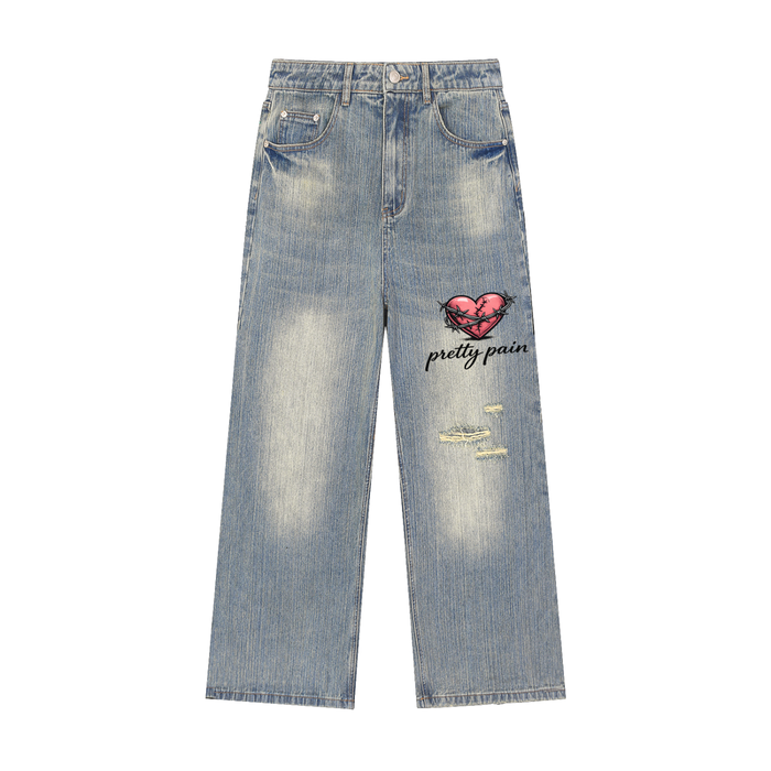 Vintage wash distressed denim jeans by Built From Pain, featuring a relaxed fit and worn-in style.
