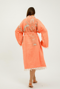 Buldano Jungle Kimono featuring elephant print, displayed on a hanger with vibrant jungle and elephant design fabric.