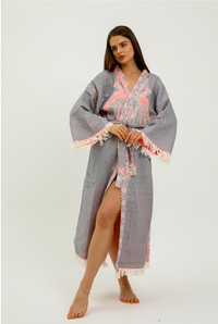 Pink jungle kimono featuring elephant print by buldano, with floral and animal patterns, soft fabric, and relaxed fit for women.