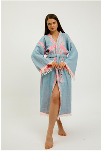 Pink jungle kimono featuring elephant print by buldano, with flowing fabric and vibrant jungle-themed design.