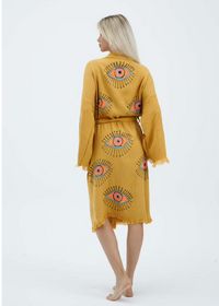 Black evil eye hand-printed kimono by Buldano, featuring natural fabric and intricate design, displayed on a neutral background.