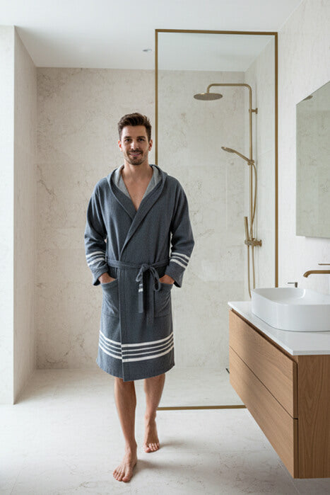 Man wearing a navy organic Turkish cotton short bathrobe with hood, lightweight Turkish towel robe by Buldano.