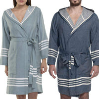Turkish Turkish cotton short bathrobe with hood by buldano, lightweight and soft, shown hanging on a hook with a natural background.