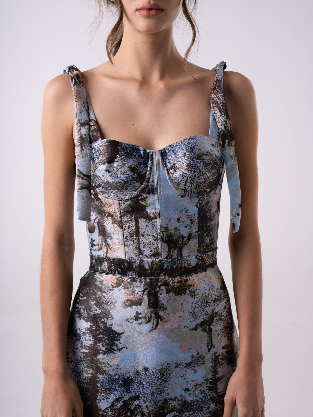 Carolina Sanz VEGA bustier top in black, fitted design with adjustable straps, shown on a mannequin.