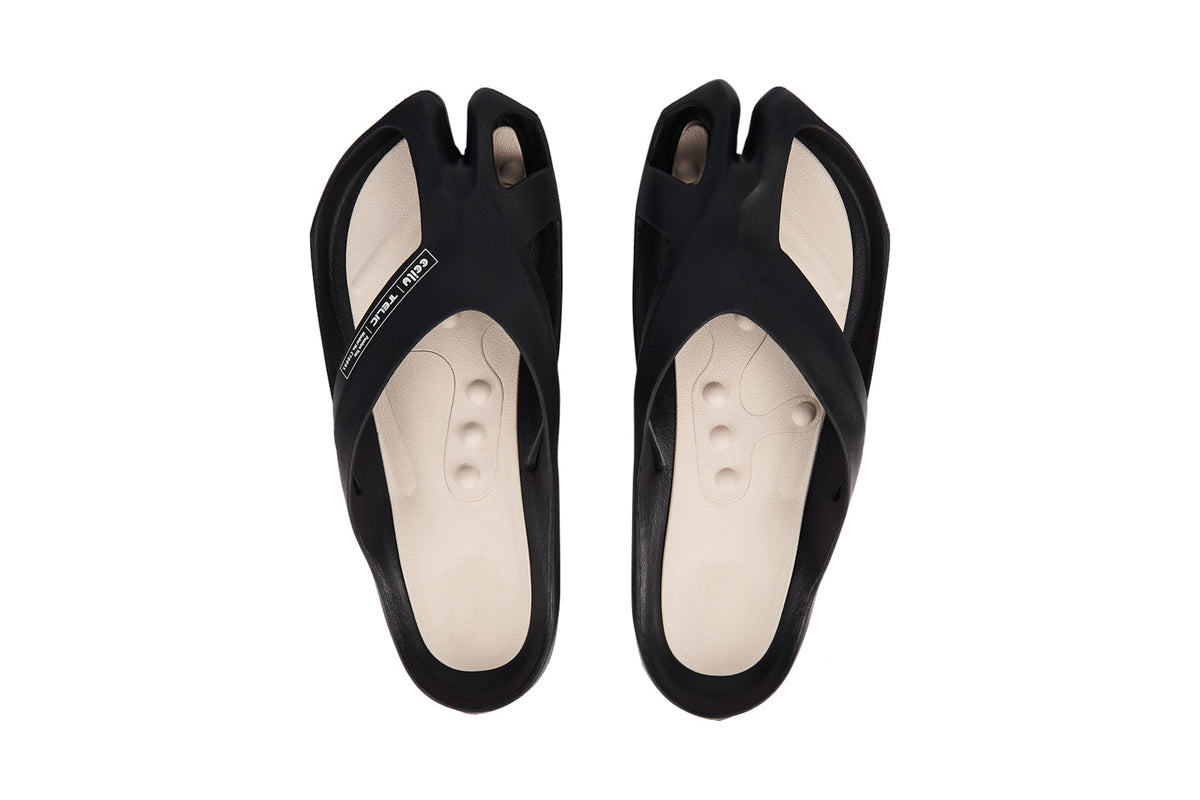 CCILU women's stepping stones caring sandals in charcoal black, featuring comfortable slip-on design with textured sole.