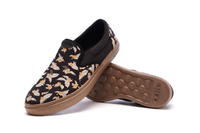 Women's CCILU XpreSole Cody shoes in black with white soles, stylish slip-on sneakers with breathable fabric and casual design.