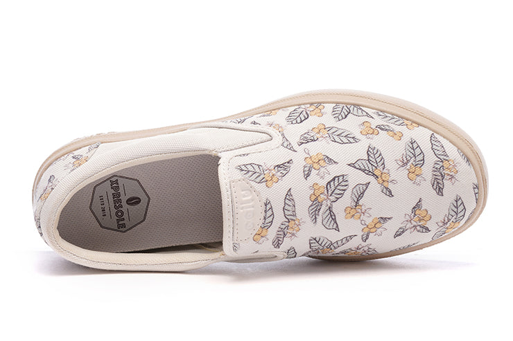 Women’s CCILU XpreSole Cody sandal with beige straps and textured sole, showcasing a casual slip-on design.