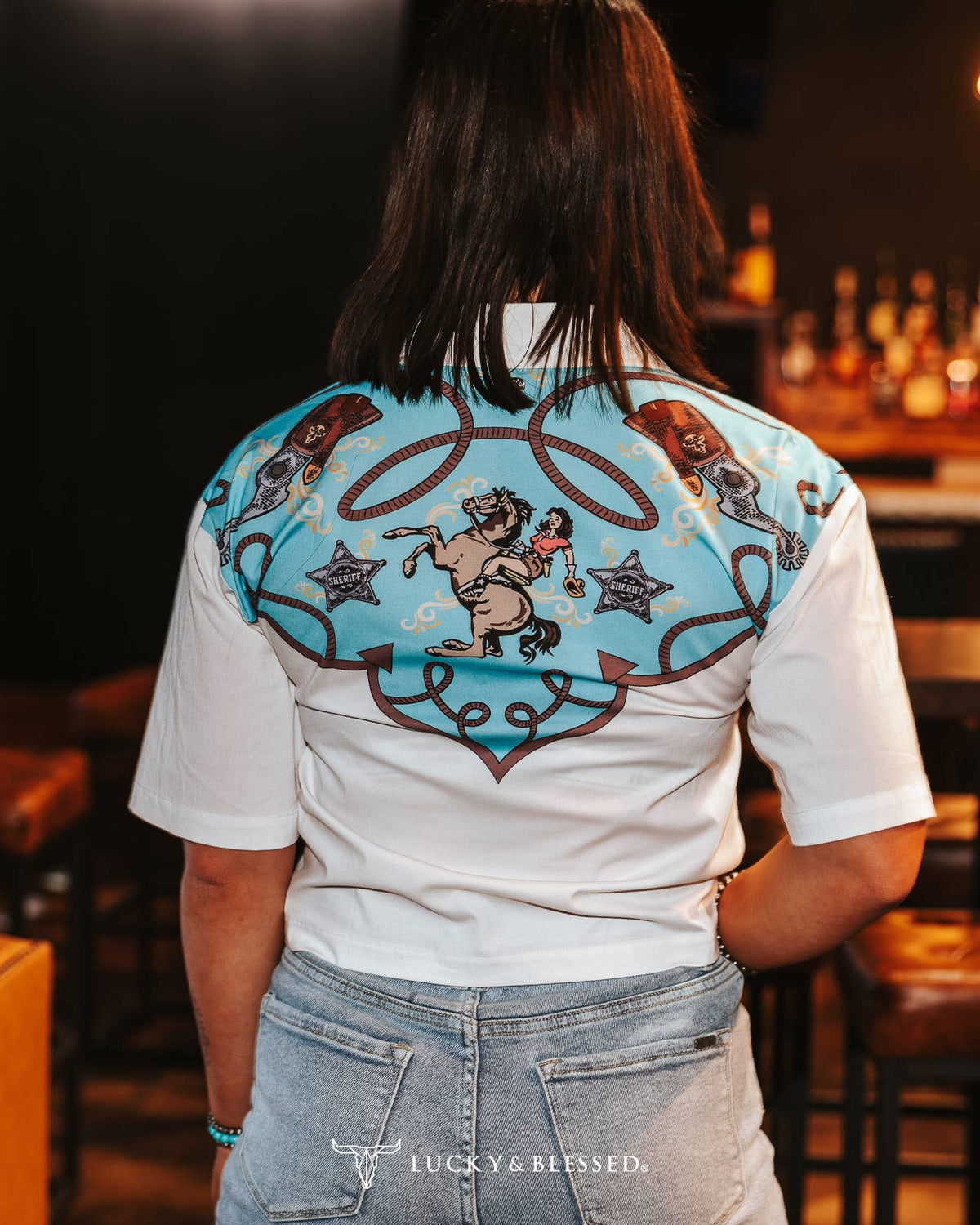 Silver Screen women's short sleeve button-down top by Cowhide and Conchos, featuring a stylish silver finish and casual fit.
