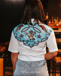 Silver Screen women's short sleeve button-down top by Cowhide and Conchos, featuring a stylish silver finish and casual fit.
