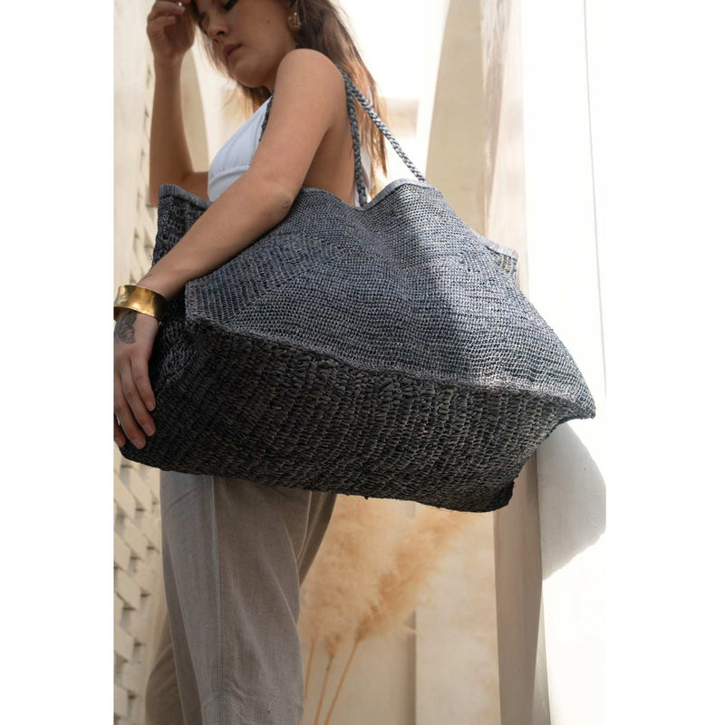 Blue Clipa XXL Raffia Beach Tote Bag by DC-Powered by People with woven raffia exterior and spacious interior for beach essentials.