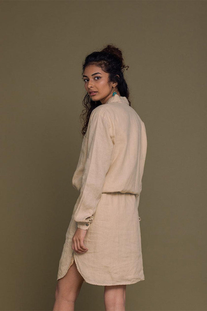 Neutral beige Meet Me by the Cliff Dress by DC-Reistor displayed on a model, featuring a flowy silhouette and elegant design.