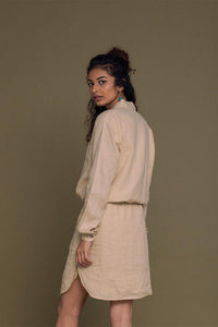 Neutral beige Meet Me by the Cliff Dress by DC-Reistor displayed on a model, featuring a flowy silhouette and elegant design.