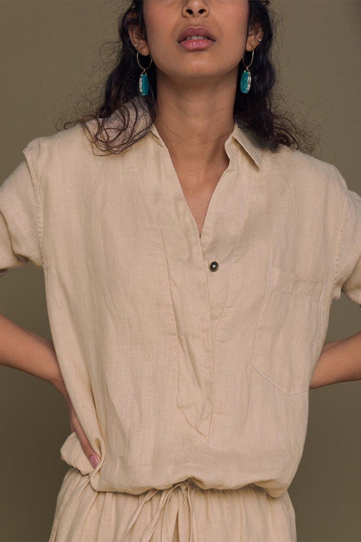 DC-Reistor Meet Me by the Cliff Dress in neutral beige, sleeveless design with a flowing silhouette and subtle detailing.