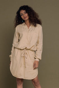DC-Reistor Meet Me by the Cliff Dress in neutral beige, flowing fabric, and elegant design perfect for casual or dressy occasions.