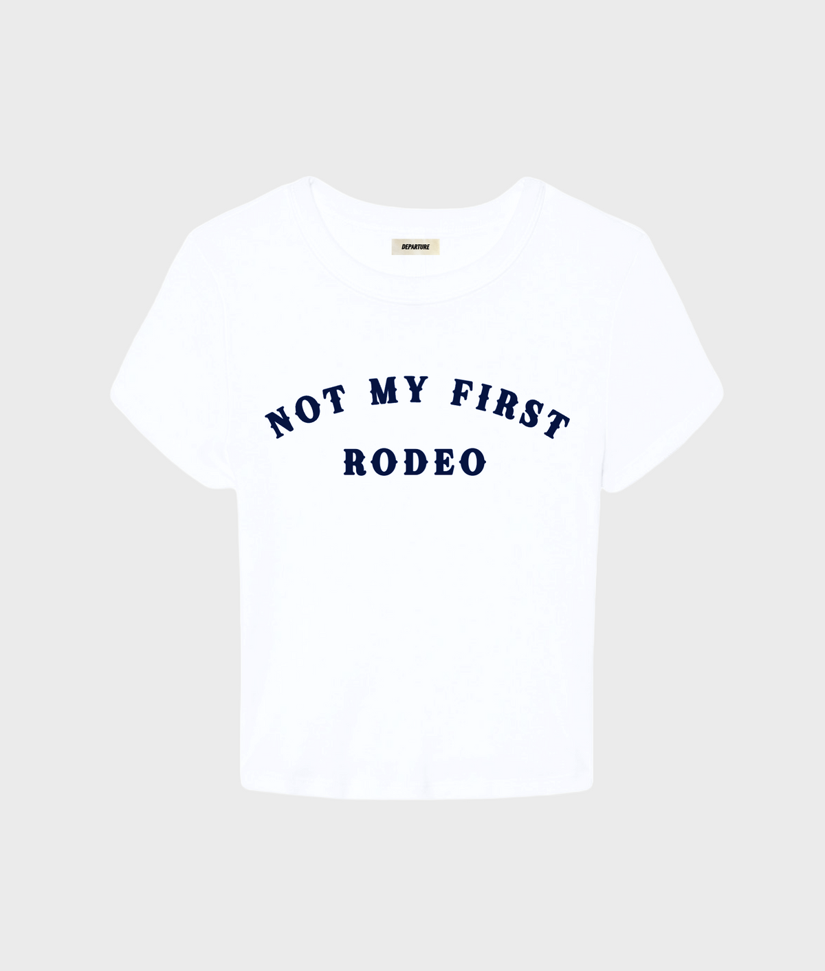 Gray "Not My First Rodeo" baby tee by Departure, close-up of the soft cotton T-shirt with printed slogan on front.