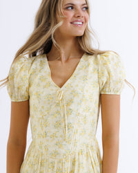Downeast Sunshine State of Mind Dress in butter yellow with colorful floral pattern, casual sleeveless summer dress.