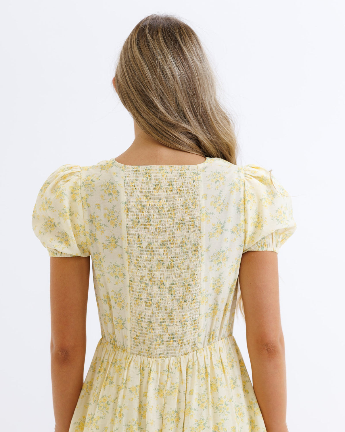 Downeast Sunshine State of Mind Dress in butter yellow with colorful sun and floral print, sleeveless summer dress for women.
