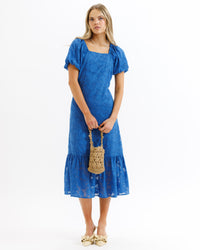 Bright cobalt Downeast Perennial Dress for women, lightweight with a feminine fit, shown on a model.