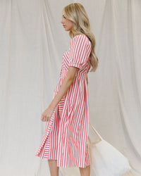 Bright red striped Downeast Must Have Mitered Dress, styled with a flattering fit and elegant design.