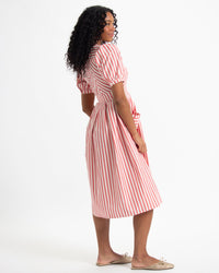 Bright red striped Downeast Must Have Mitered Dress shown on a model, featuring a stylish mitered neckline and fitted silhouette.