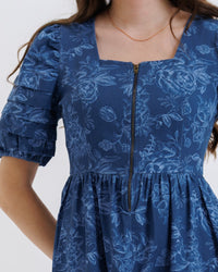 Downeast floral denim Obsessed Dress in XS displayed on a hanger, showcasing casual summer style with a floral pattern.