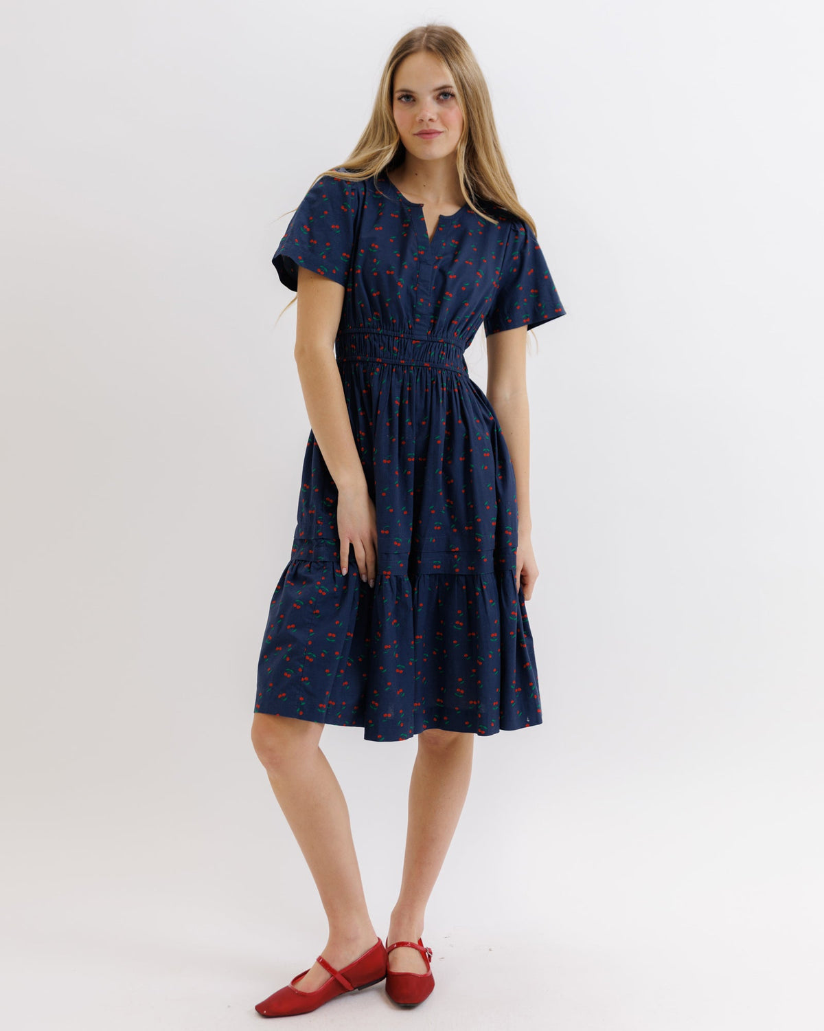Downeast Icon Demi Dress in lightweight fabric with a feminine silhouette and subtle pattern, displayed on a hanger.