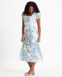 Downeast In Bloom dress displayed on a hanger with floral pattern and vibrant colors, showcasing a stylish and casual women's dress.