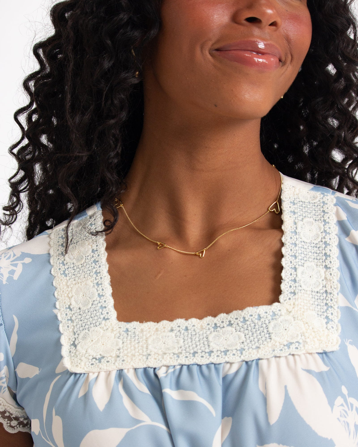 Downeast In Bloom dress with floral pattern, sleeveless design, and flowy fabric, perfect for spring and summer wear.