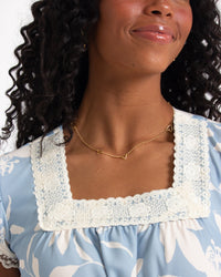 Downeast In Bloom dress with floral pattern, sleeveless design, and flowy fabric, perfect for spring and summer wear.